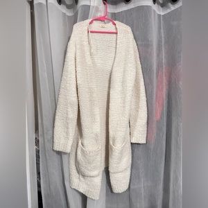 white fluffy cardigan by debut